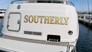 Gold outline vinyl boat name on a white hull