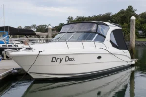 Dry Dock vinyl boat name on a cabin cruiser hull